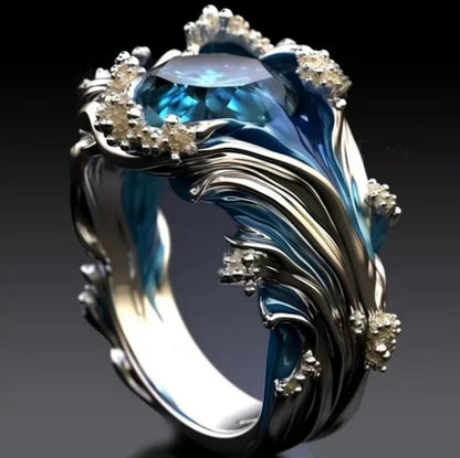 SILVER BLUE TOPAZ OCEAN WAVE RING - (ADJUSTABLE)