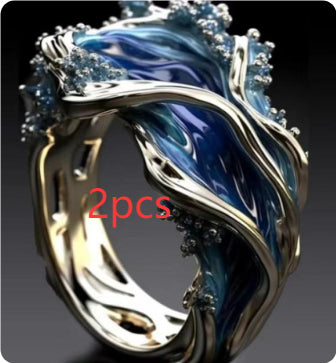 SILVER BLUE TOPAZ OCEAN WAVE RING - (ADJUSTABLE)